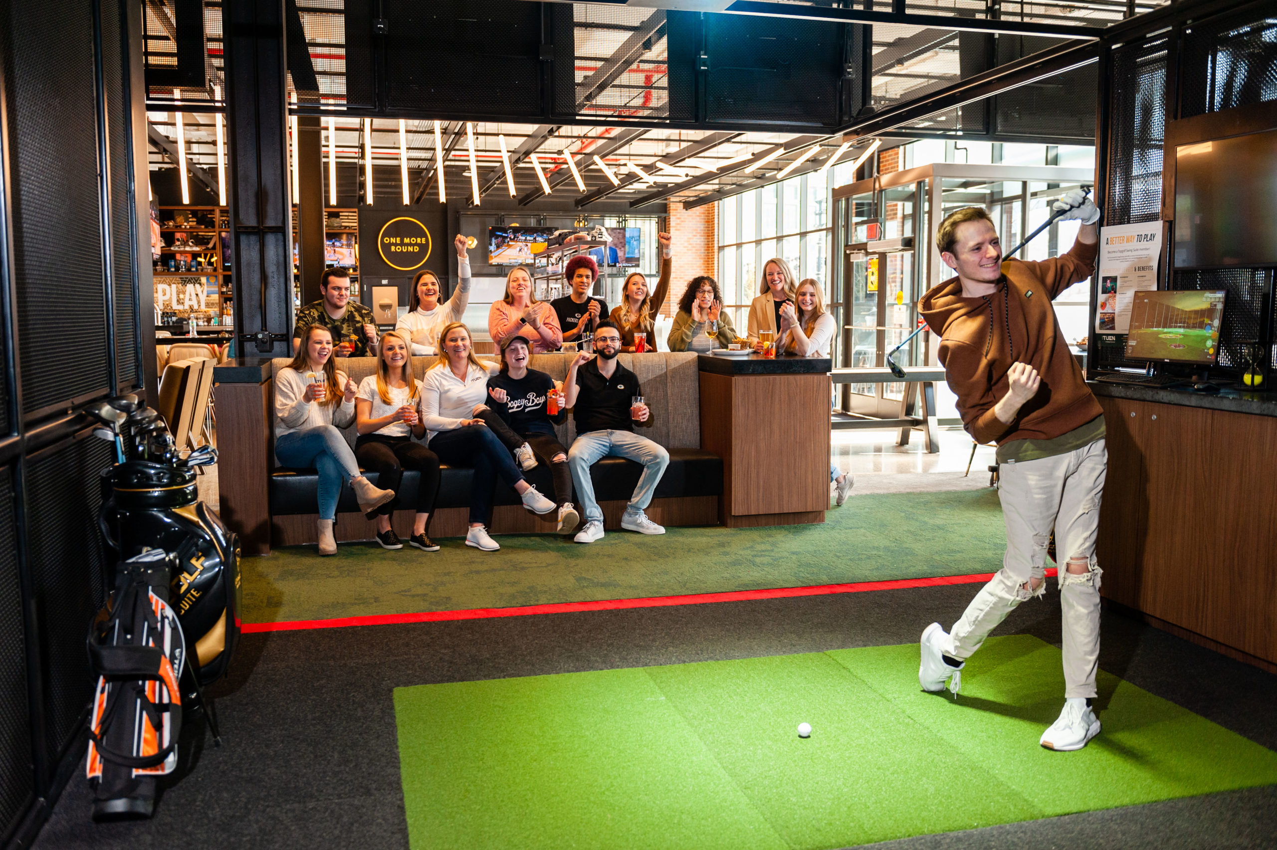 Photo of group in a Topgolf Swing Suite